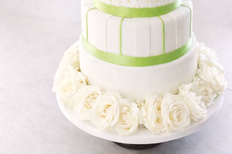 classic-white-wedding-cake-green-bow-floral-fort-collins.jpg