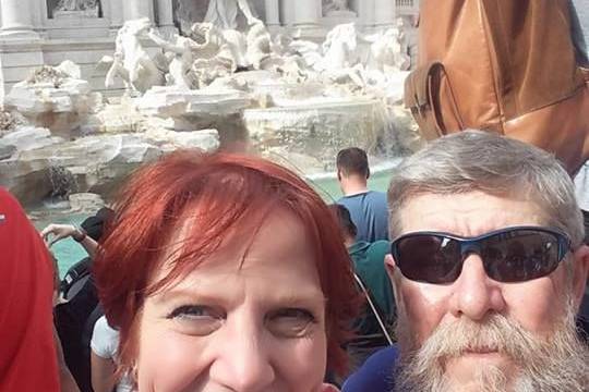 Rome and a visit to the Trevi Fountain has this happy couple smiling.