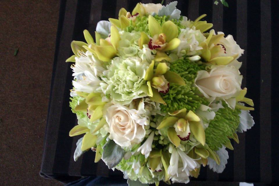 Green orchids, green spiders, ivory roses, hydrangea
