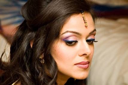 Modern Indian wedding reception hair and makeup look.