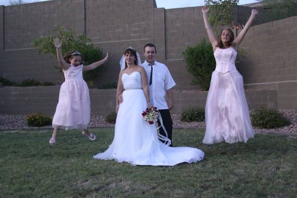 The bridesmaids jumping for joy.