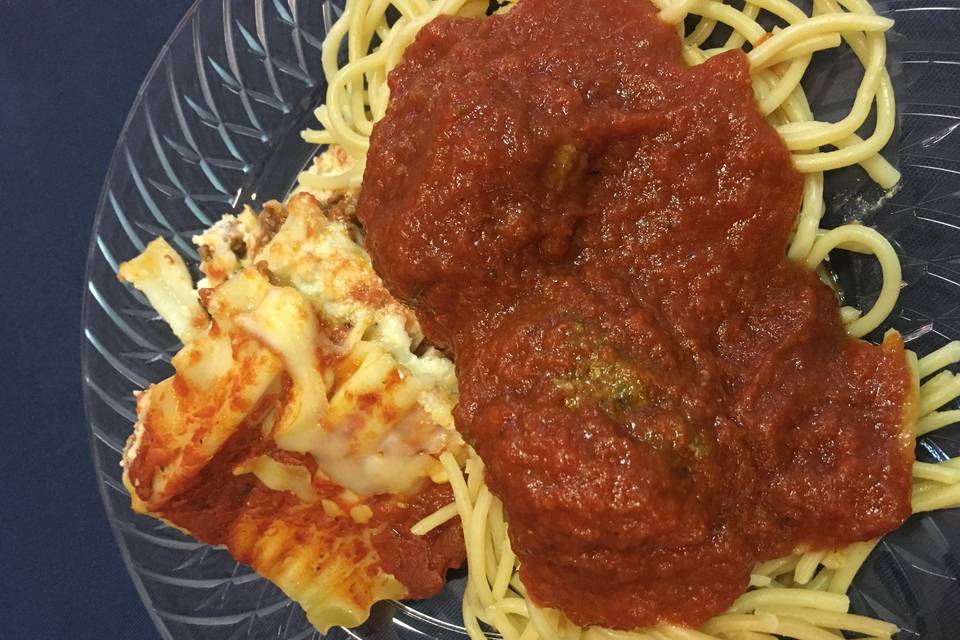 Homemade lasagna with spaghetti and meatballs