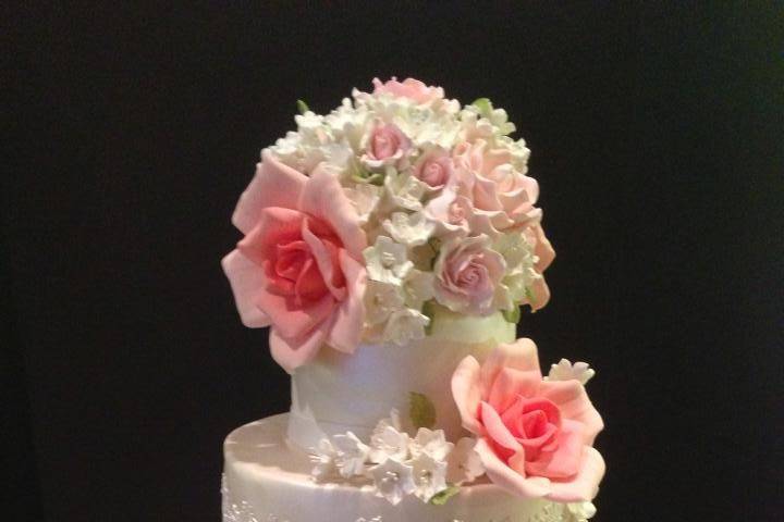 Black & White Swiss Dot Wedding Cake.  Gum paste flowers tipped in gold.