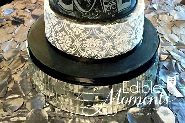 Chalk board themed wedding cake. Silver leaf band on top tier & full silver leaf on bottom tier with damask overlay pattern.