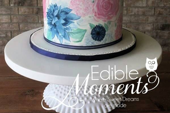 4-tier fondant design with quilting & pearl accents.  Edible lace to coordinate with the bride's dress.