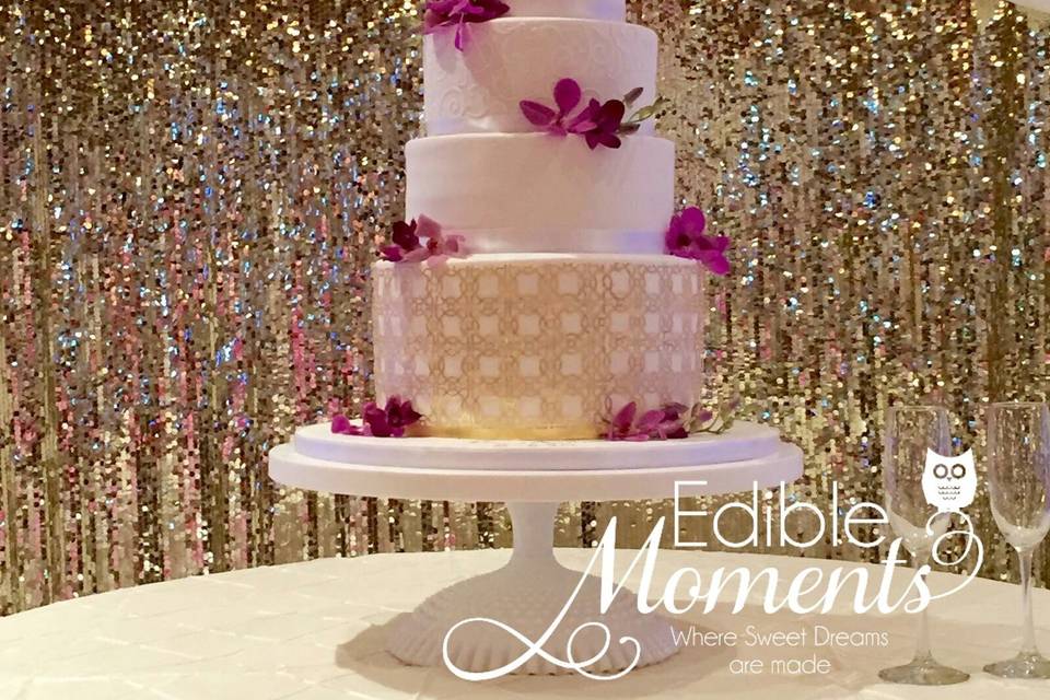 5-tier fondant covered wedding cake.  Edible Gold leaf patterns add a sophisticated elegance.