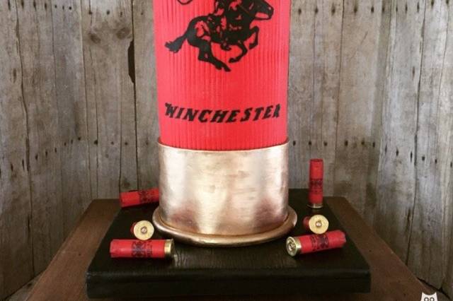 Trevor hunts so we came up with a shot gun bullet idea for his groom's cake.  His favorite brand is:  Winchester.  We were thrilled with how this 3-D structure cake turned out !  It was a hit & FUN conversation piece.