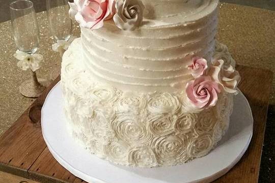 3-tier Butter cream cake.  Gum Paste flowers custom colored to bride's decor.