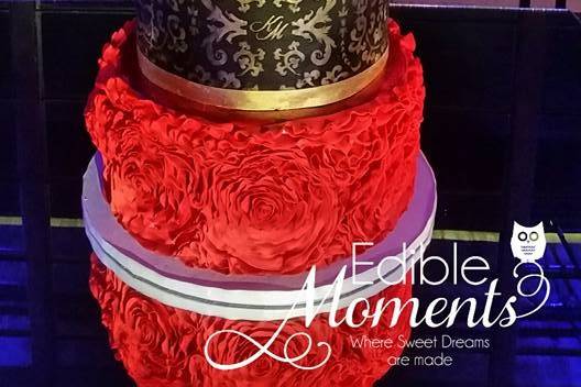 Colorful wedding cake design!  IKAT focal tiers designed within an art frame.  Bridal monogram & stencil was custom designed. Bottom tier is red chocolate rosettes.