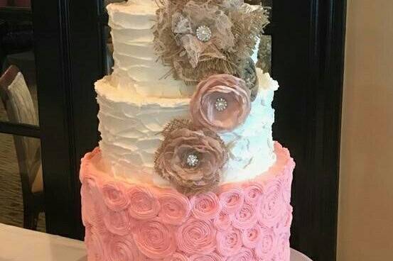 We LOVE it when a bride is interested in adding color to her cake.  All butter cream.  Double Barrel Pink Rosette bottom tier!