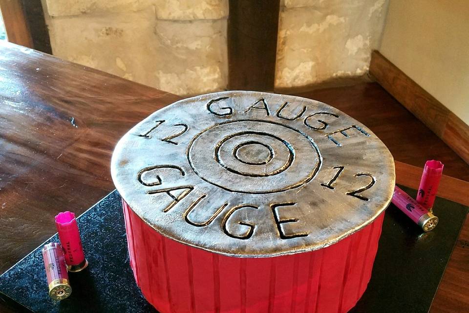 12 gauge bullet groom's cake.  For all you hunters out there, a FUN way to showcase your skills...