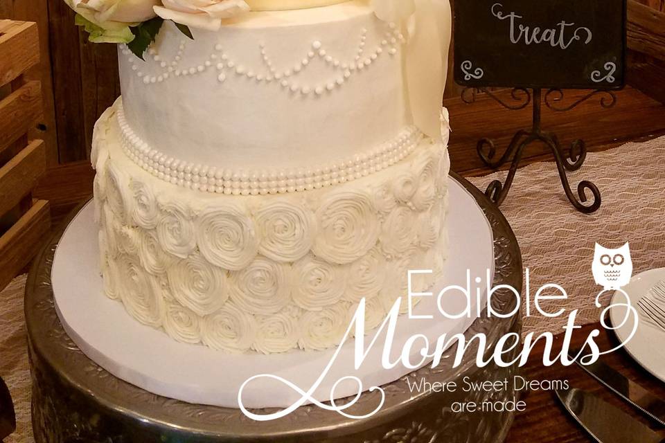 Butter Cream Wedding cake with fondant pearls, edible lace, stenciling, and rosettes