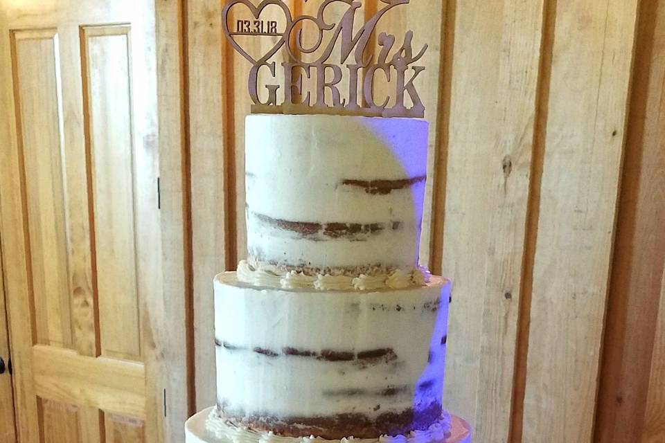 Butter Cream Wedding cake with fondant pearls, edible lace, stenciling, and rosettes