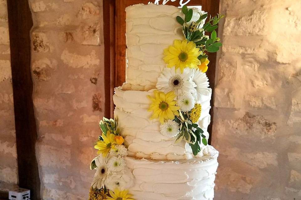 3-tier Butter cream cake.  Gum Paste flowers custom colored to bride's decor.