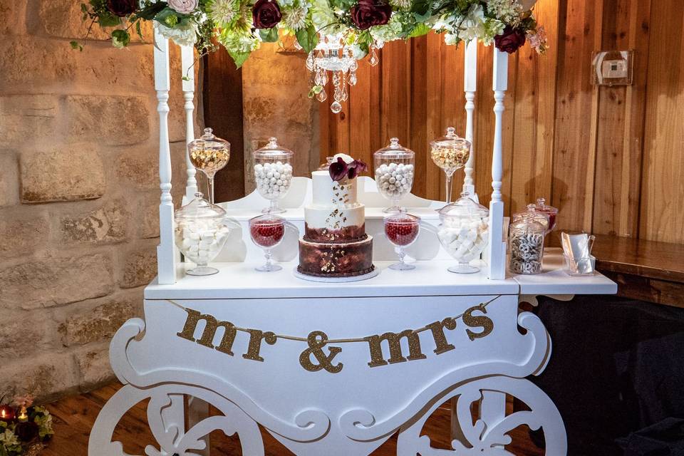 Butter Beauty Wedding Cake featuring a hand-painted gold tier & rosettes!