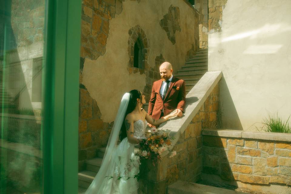 Bride & groom pose on stairs