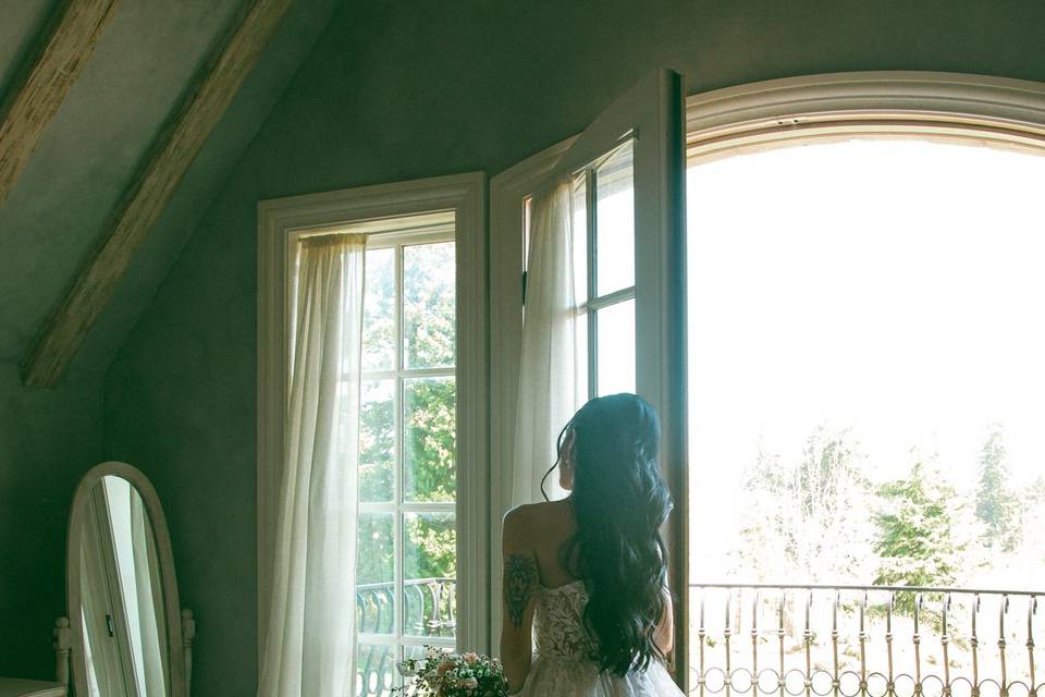 Bride checks makeup in mirror