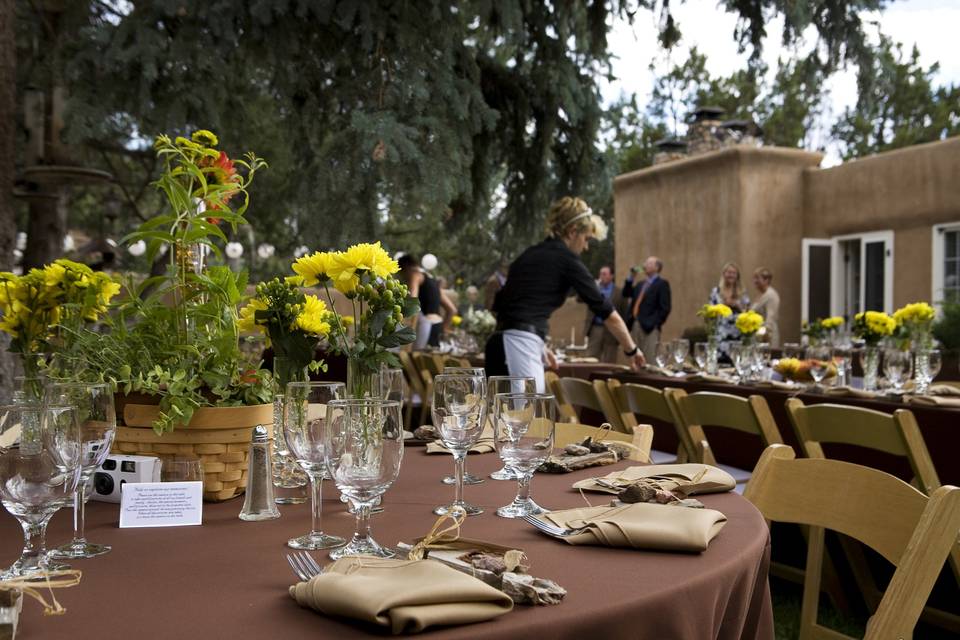 Table setup with orange flower centerpiece