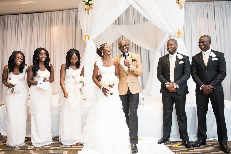 The couple with their groomsmen and bridesmaids