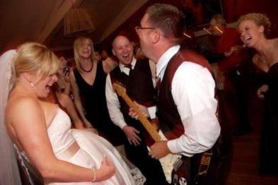 Bride and her air guitar!