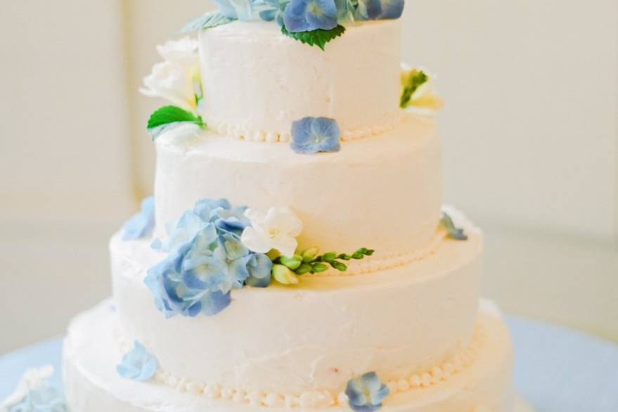 Blue flowers on white cake