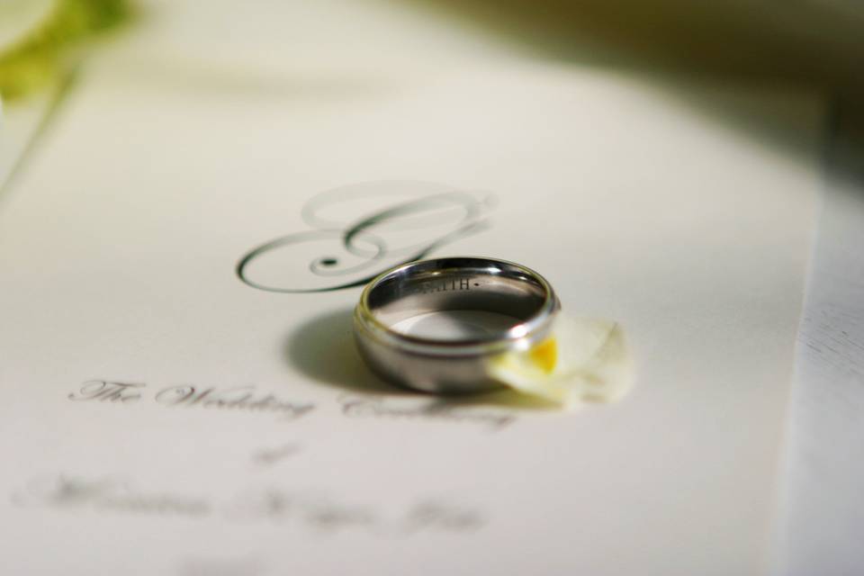Groom's ring and invitation.