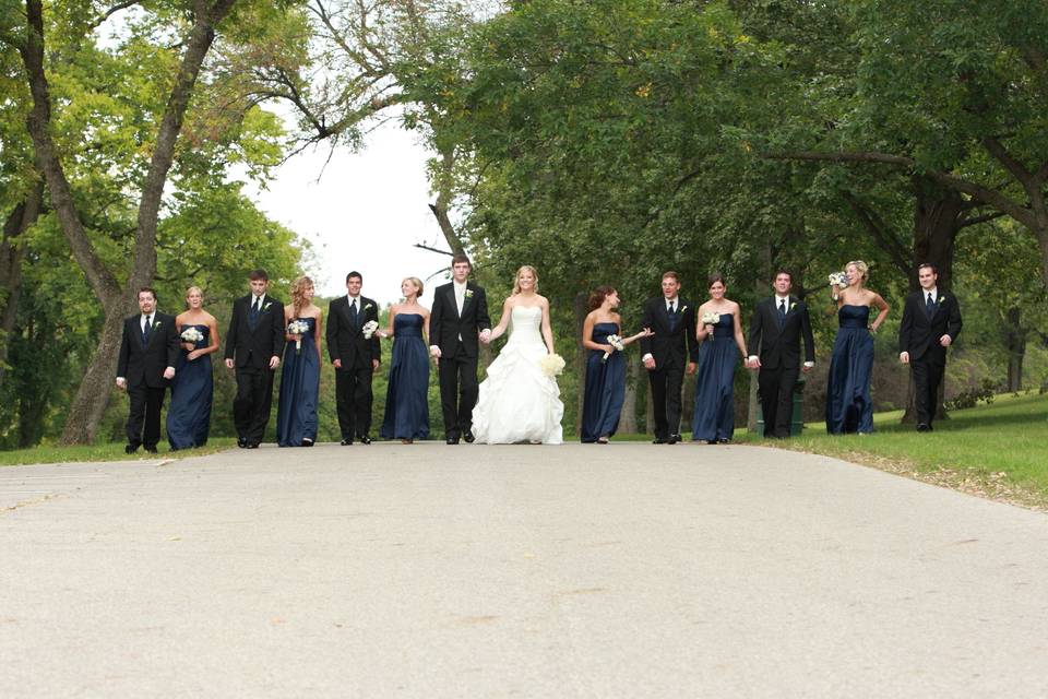 Wedding party standing on a road
