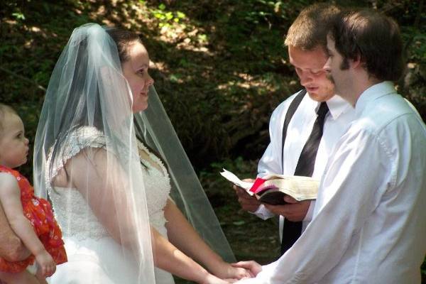 Jessica and Randy saying their marriage vows to one another.