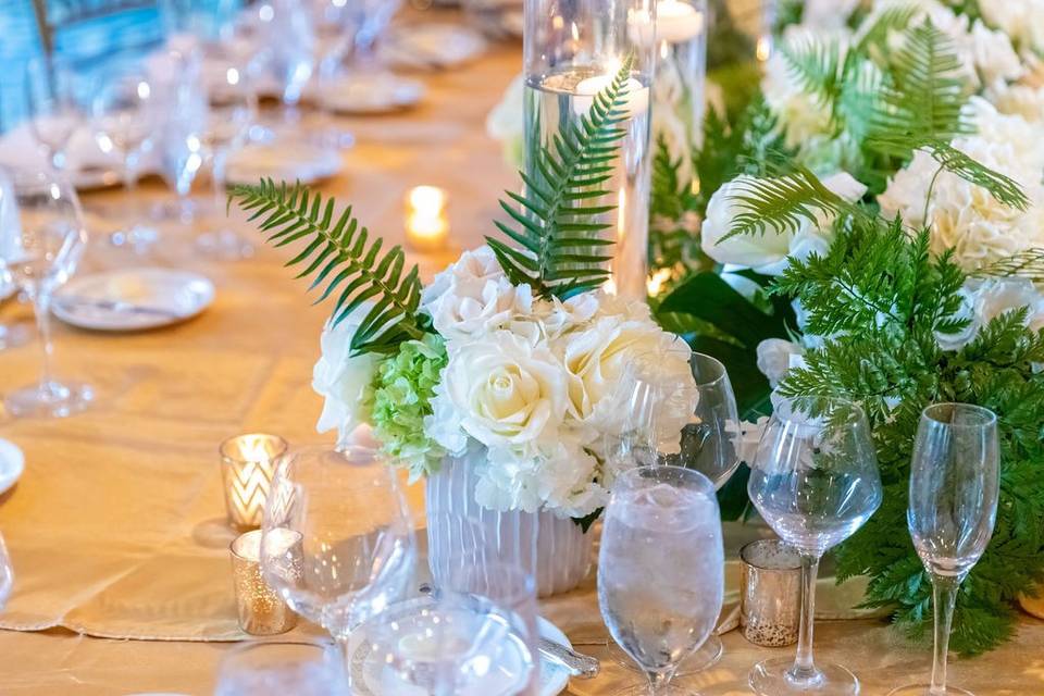 White table arrangement with foliage