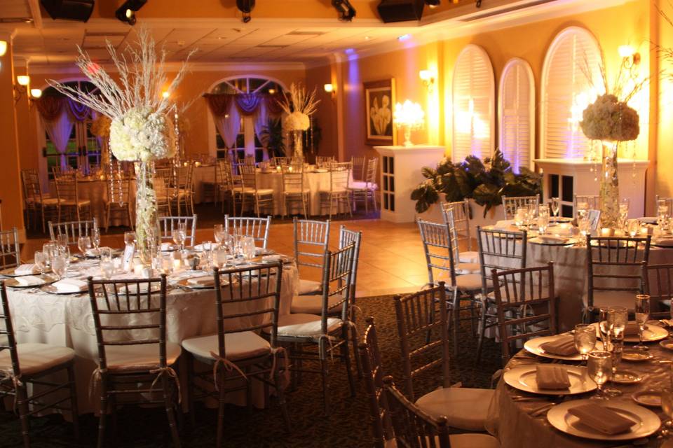 Wedding reception with brass chairs