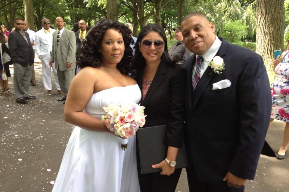 Bride and groom with their wedding officiant