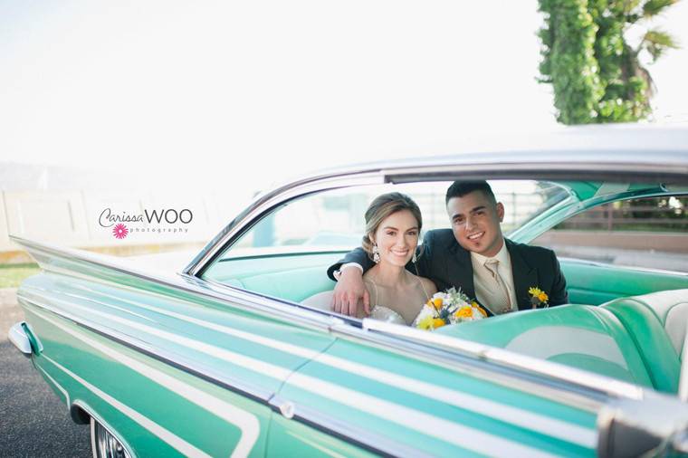 The couple at their bridal car