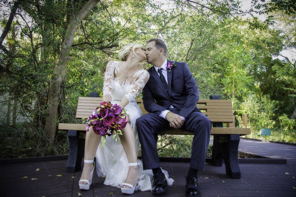 Sneaking a kiss before a reception at Key West Botanical Gardens