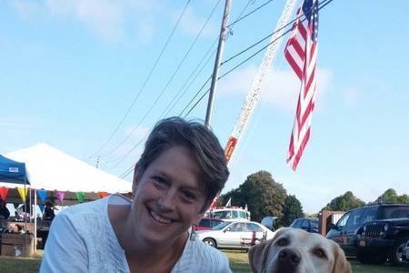 Chaplain claudia and one of her canine friends.