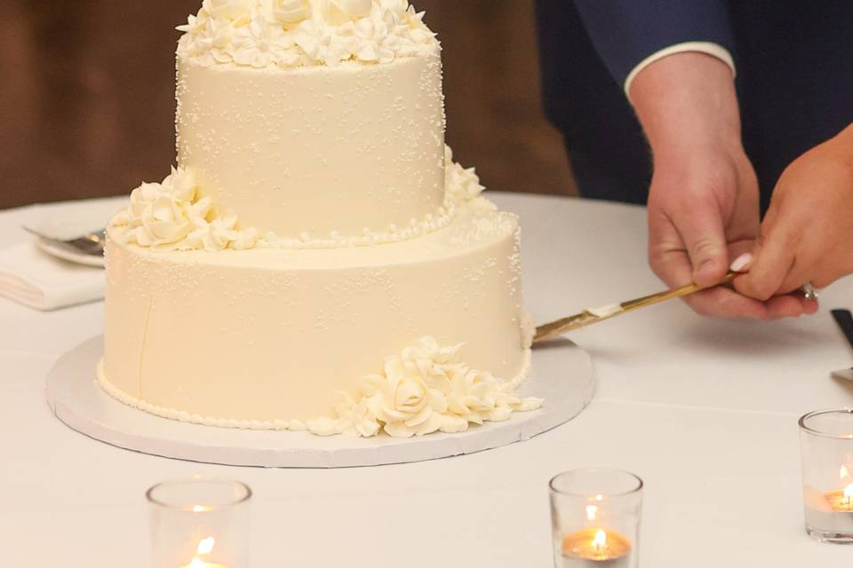 Couple Cutting Wedding Cake