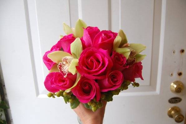 Ravel pink roses and green cymbidium orchids
