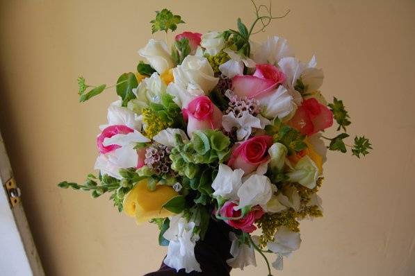 pink, yellow, white roses, bells of ireland, snapdragons