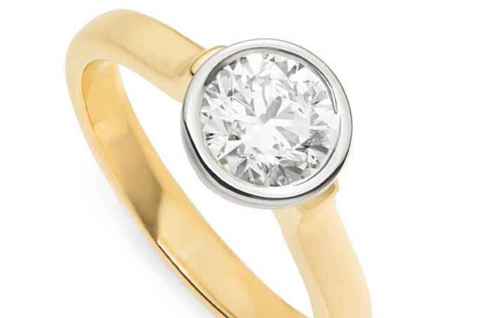 The Floating diamond ring effortless to wear and love. Accommodates a straight wedding band on either side. Pictured with a 1.25ct round diamond in two-tone #010428