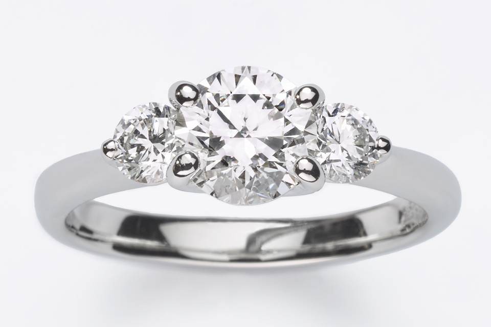 Always a classic, this platinum ring cradles three colorless round brilliant diamonds, for the woman who wants simplicity with tons of sparkle.