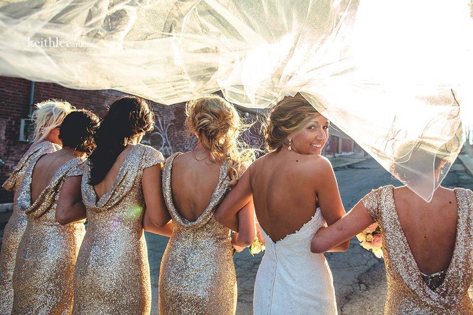 Candice and her bridesmaids in gold glamour.