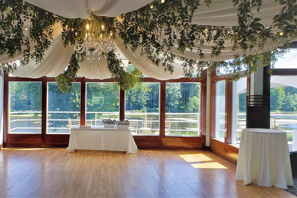 Ceiling draping with greenery