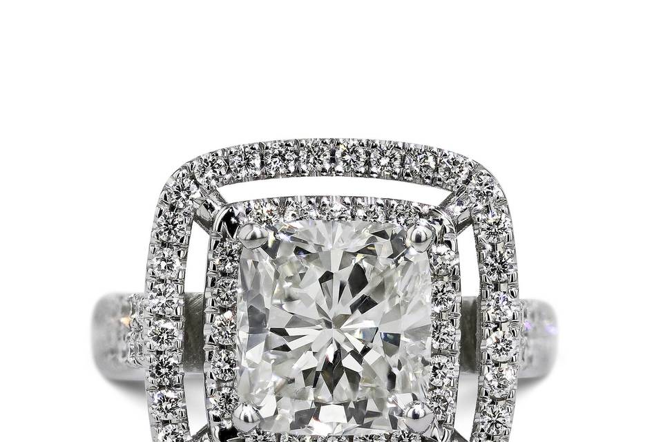 Cushion Style Double Halo Engagement Ring. Center Diamond is 3.07 Carat E VS2 & side diamonds are total of 0.86 Carat giving a total of 3.93 Carat. Order Now and get 30 day money back guarantee & 5 years gold warranty.
