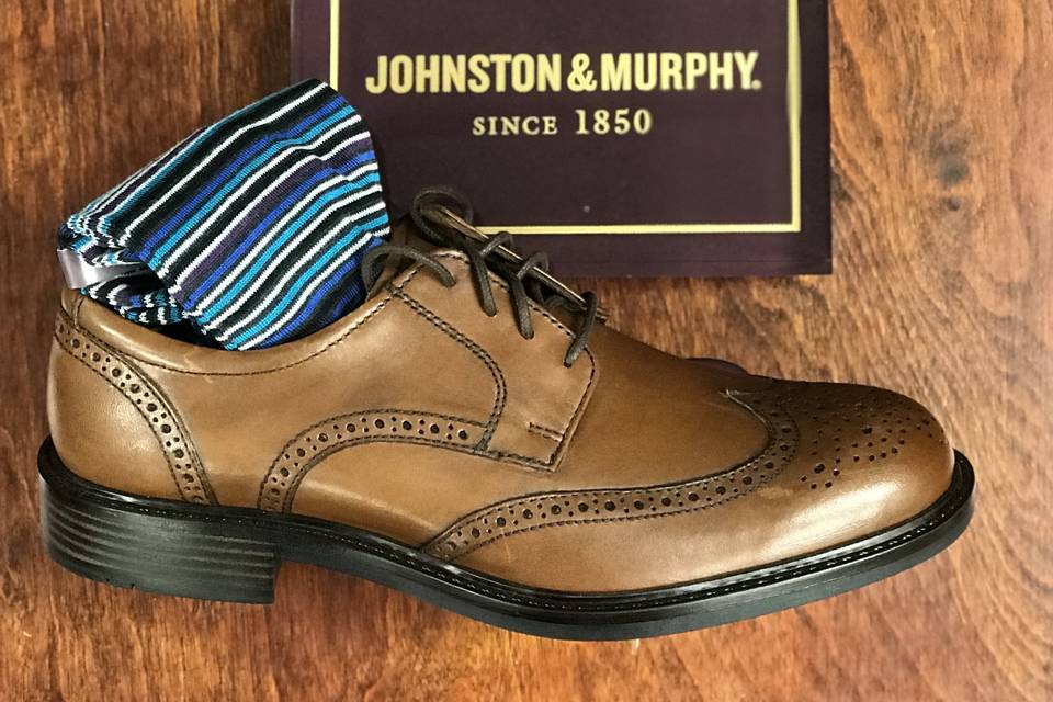 Brown dress shoes with striped socks
