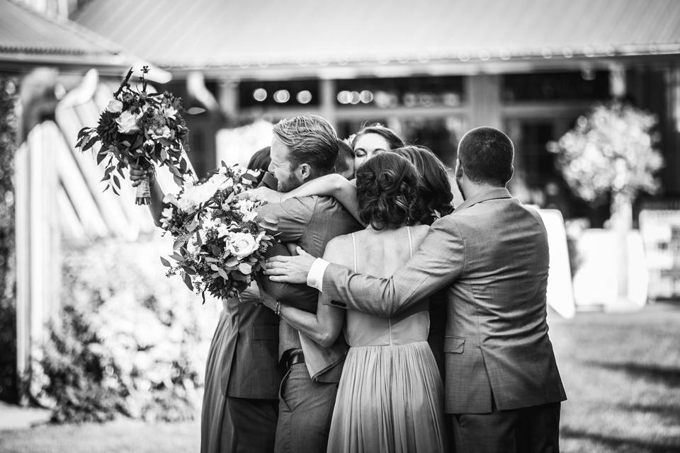 Wedding party group hug