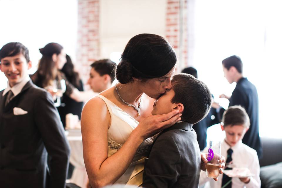 Bride kissing son