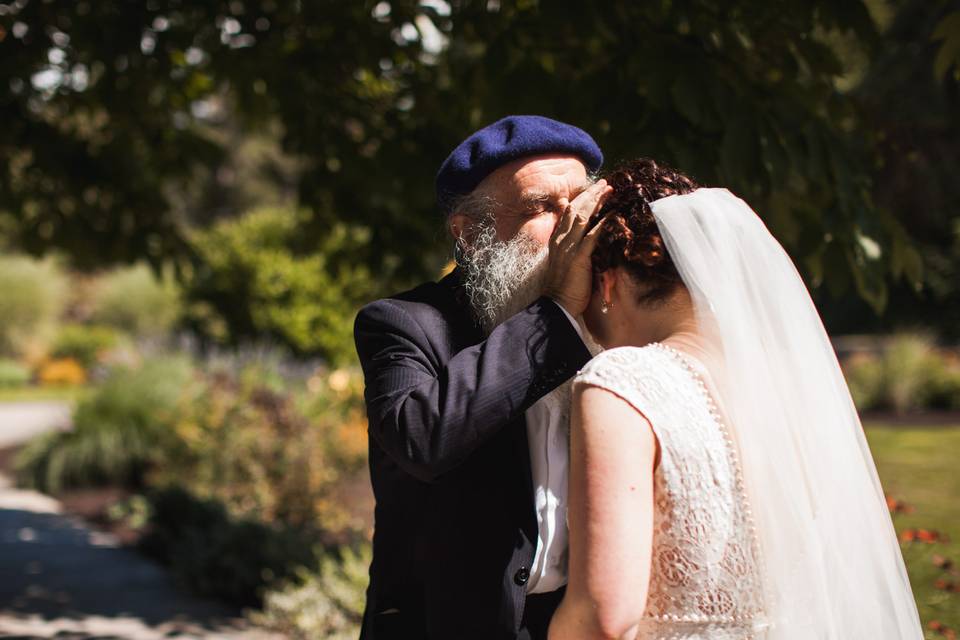 Father kissing bride