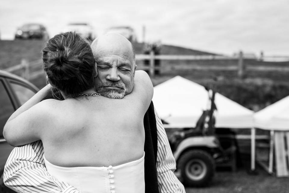 Dad hugging bride