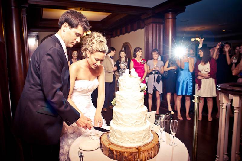 Couple cutting their wedding cake