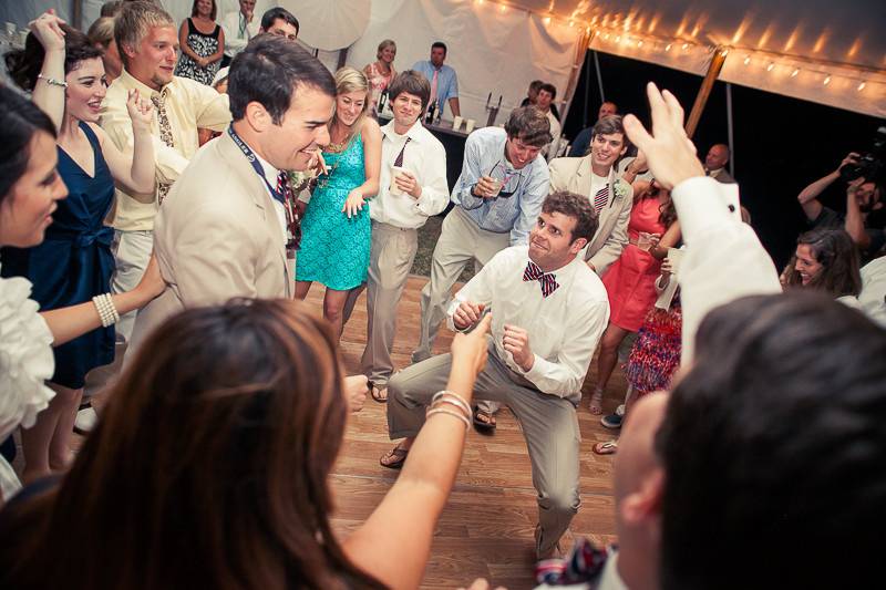 Groom dancing with their guests