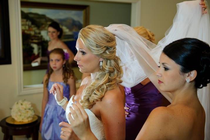 Assisting the bride with her veil